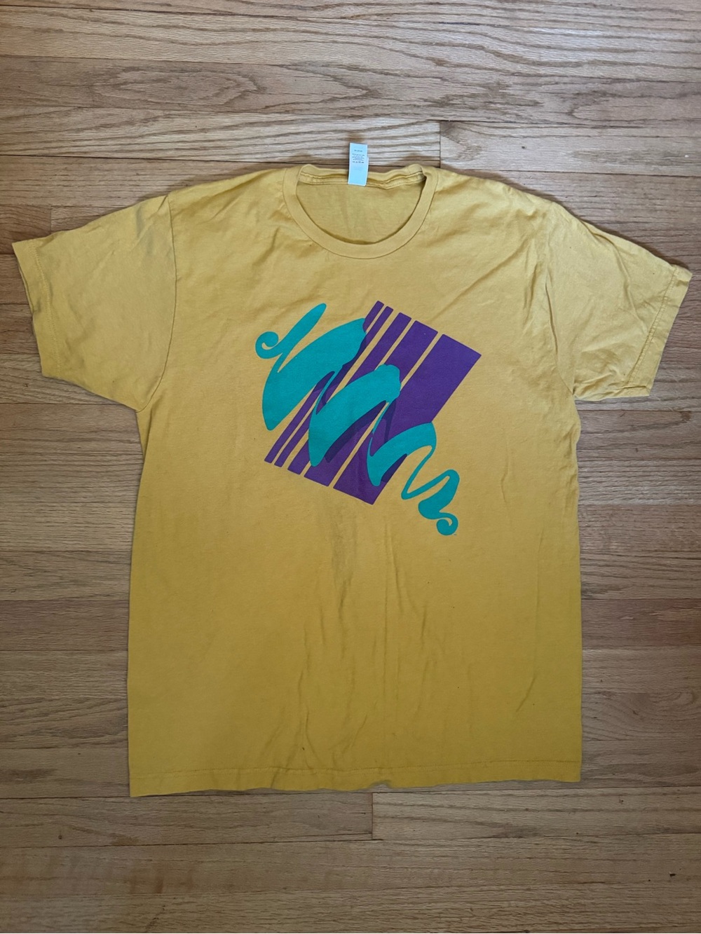 Mustard Yellow Graphic Tee with Teal & Purple Design